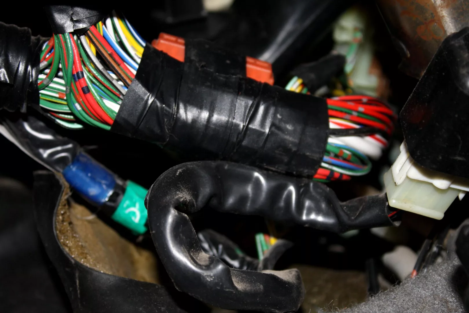 image shows electrical tape wrapping wiring looms