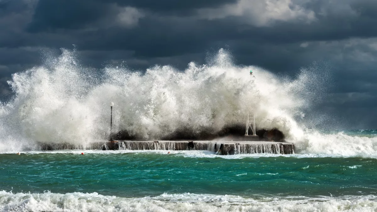 image shows waves crashing on rocks to simulate environmental exposure testing